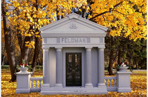 Feloman white stone mausoleum with columns and two vases