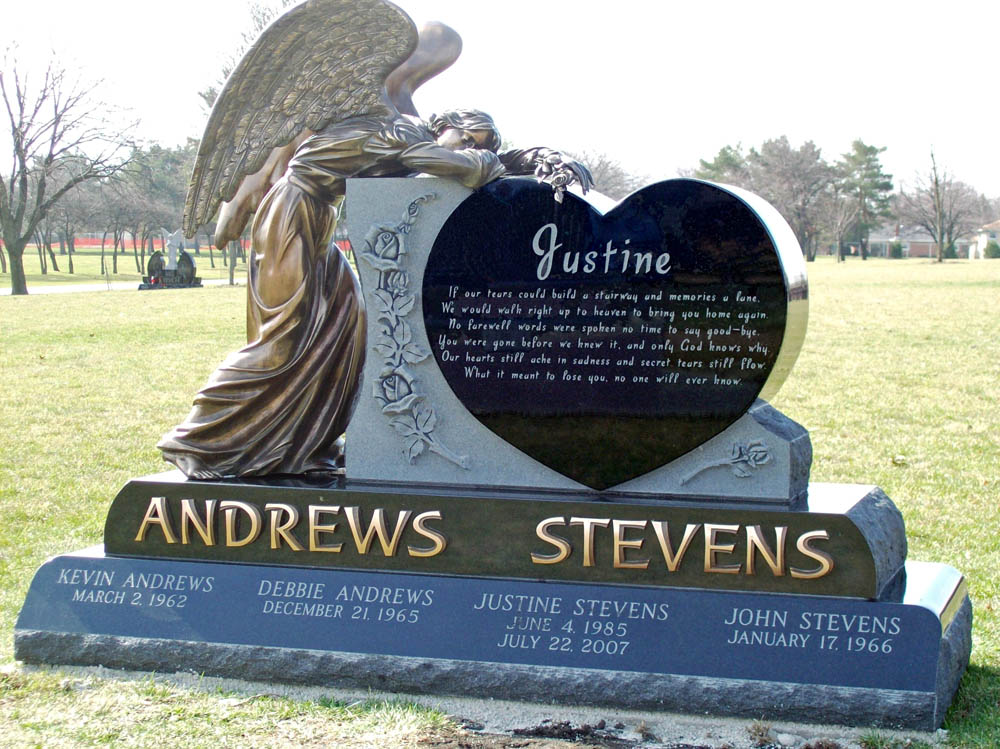 Heart shaped family monument with bronze angel statue